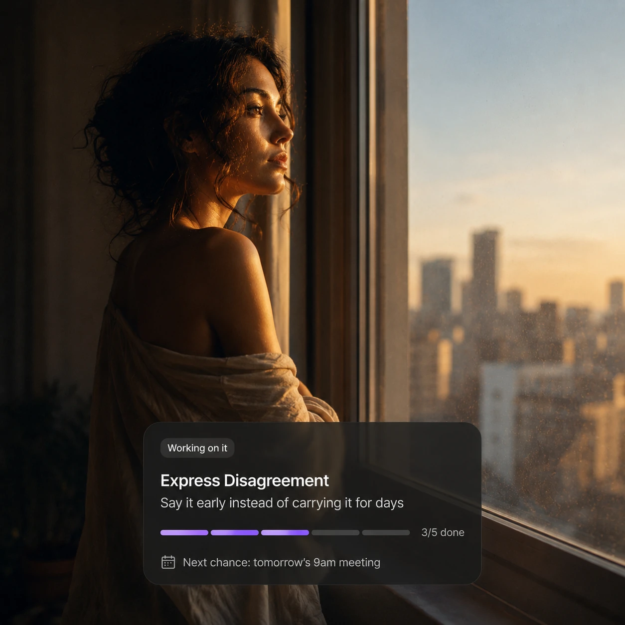 A woman by a window with a UberEgo notification tracking her progress on a personal growth goal, three of five steps done